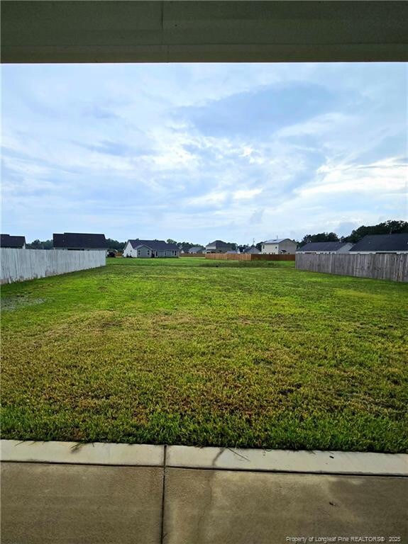 338 E David Parnell St, Parkton, NC 28371 - view of yard