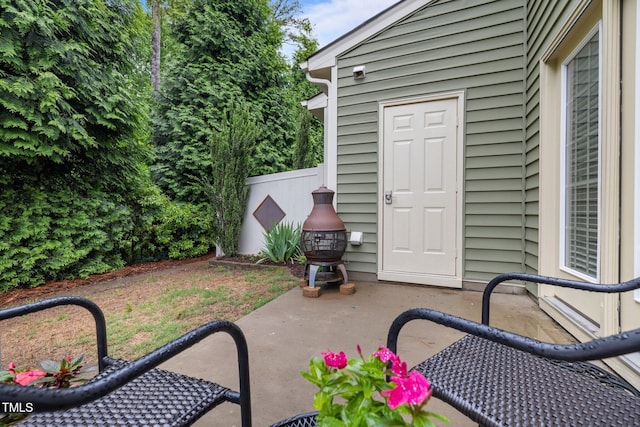 view of patio featuring fence