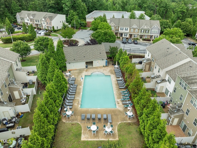 aerial view of residential area featuring a pool