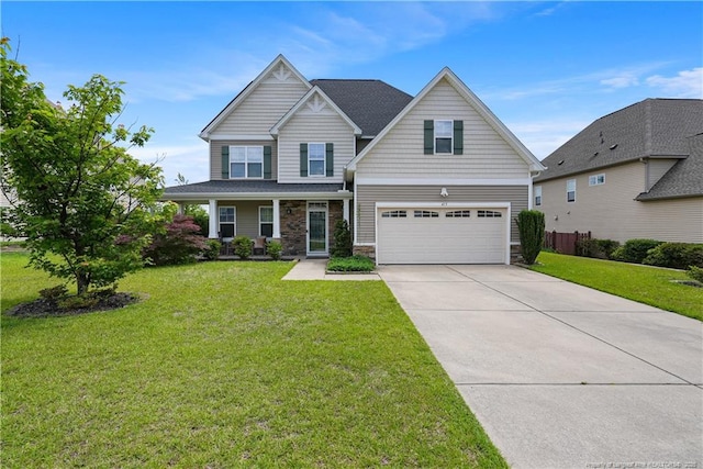 craftsman house with a garage, stone siding, driveway, and a front lawn