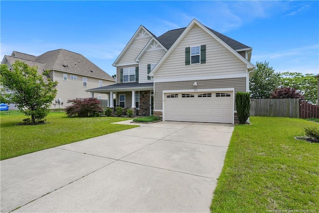 craftsman-style house with a garage, stone siding, and concrete driveway