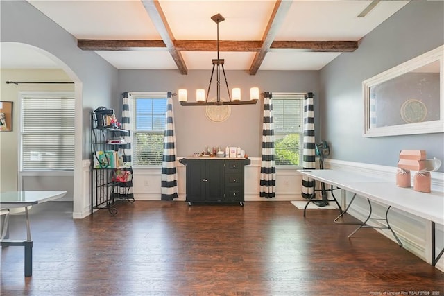 dining space featuring dark wood-style floors, coffered ceiling, a chandelier, beam ceiling, and healthy amount of natural light