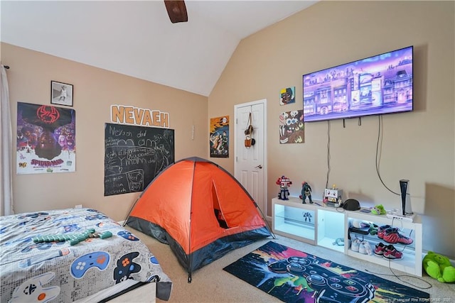 bedroom featuring carpet floors, vaulted ceiling, and ceiling fan