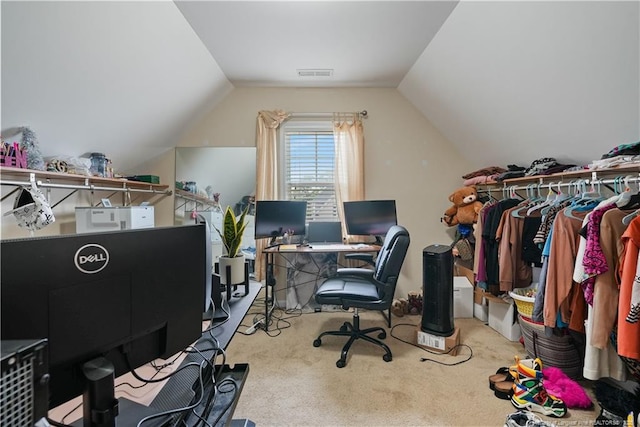 carpeted office space featuring vaulted ceiling