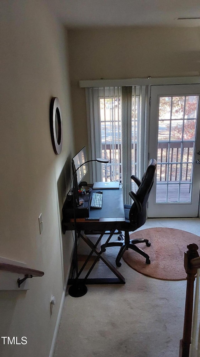 home office featuring carpet flooring and baseboards