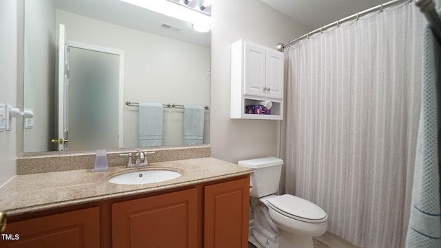 full bath featuring toilet and vanity