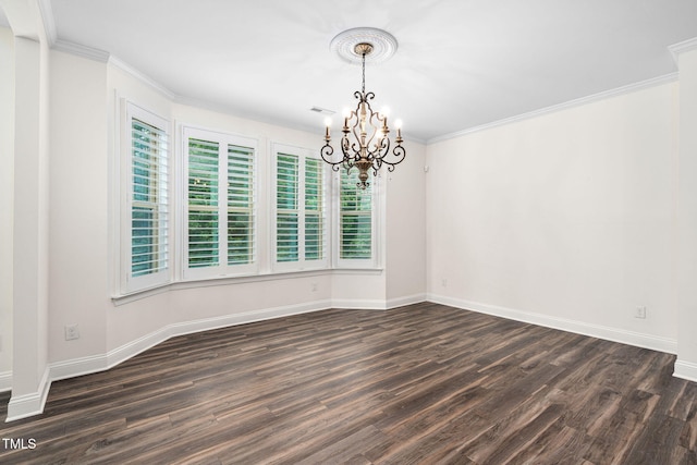 empty room featuring a chandelier, dark wood-style flooring, baseboards, and ornamental molding