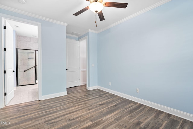 unfurnished bedroom featuring baseboards, dark wood-style floors, ornamental molding, and a ceiling fan
