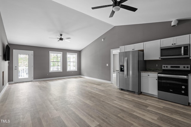 249 Fisherman Point Rd, Roxboro, NC 27574 - kitchen with appliances with stainless steel finishes, ceiling fan, lofted ceiling, white cabinetry, and light wood-style floors