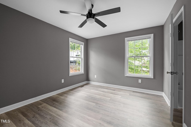 249 Fisherman Point Rd, Roxboro, NC 27574 - spare room with wood finished floors, ceiling fan, and baseboards