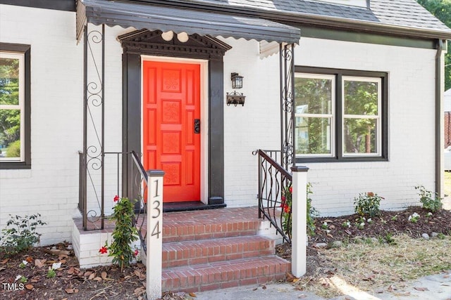134 Nelson St, Durham, NC 27707 - doorway to property with brick siding and roof with shingles