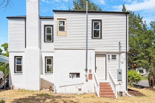 134 Nelson St, Durham, NC 27707 - rear view of house featuring a chimney and brick siding