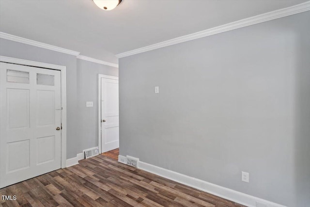134 Nelson St, Durham, NC 27707 - empty room with ornamental molding, baseboards, and dark wood-style flooring