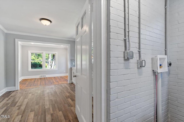 134 Nelson St, Durham, NC 27707 - hallway with dark wood-style floors, baseboards, and ornamental molding