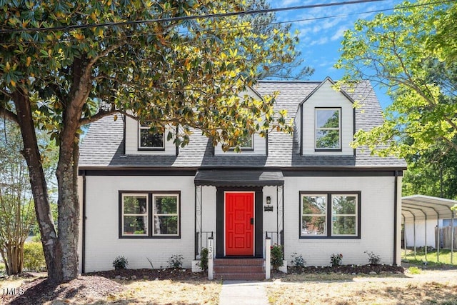 134 Nelson St, Durham, NC 27707 - view of front of house featuring brick siding, a shingled roof, a detached carport, and fence
