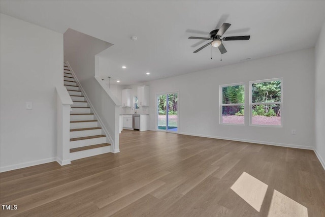 110 Hays St, Oxford, NC 27565 - unfurnished living room featuring light wood finished floors, recessed lighting, stairway, and ceiling fan