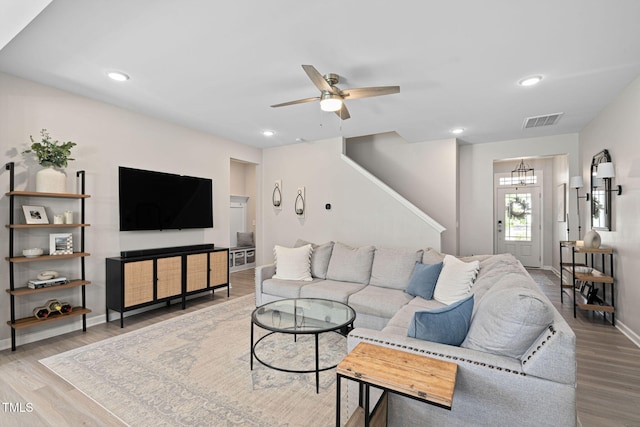 150 Gosford Ln, Garner, NC 27529 - living area with wood finished floors, a ceiling fan, stairs, and recessed lighting