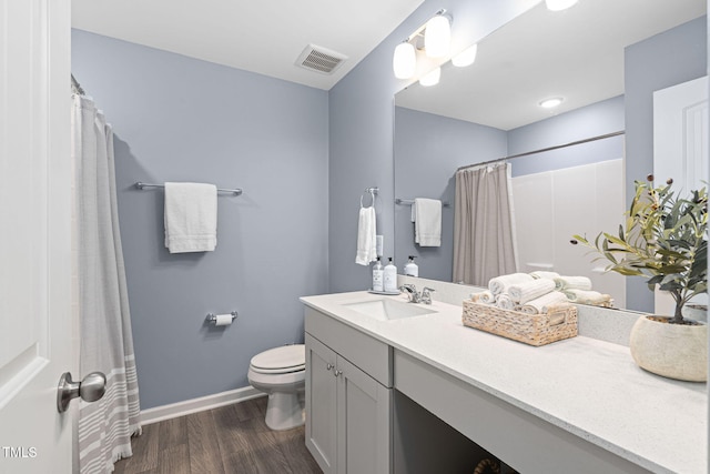 150 Gosford Ln, Garner, NC 27529 - full bathroom with wood finished floors, vanity, and a shower with shower curtain