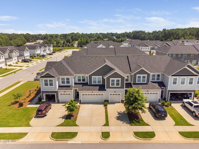 150 Gosford Ln, Garner, NC 27529 - view of front of house with a residential view, driveway, an attached garage, and a shingled roof
