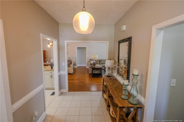 3119 Metthame Dr, Fayetteville, NC 28306 - hall featuring light tile patterned floors, baseboards, and a textured ceiling