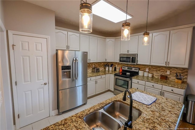 3119 Metthame Dr, Fayetteville, NC 28306 - kitchen featuring stainless steel appliances, light tile patterned floors, a sink, and tasteful backsplash