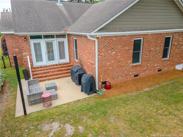 3119 Metthame Dr, Fayetteville, NC 28306 - rear view of property featuring entry steps, crawl space, a patio area, brick siding, and a shingled roof
