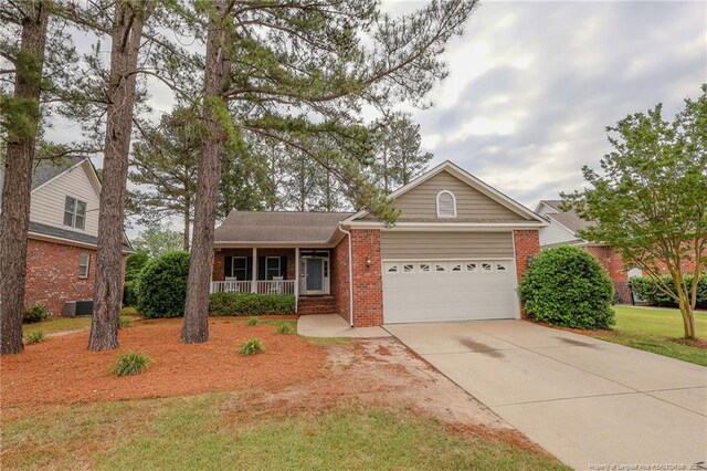 3119 Metthame Dr, Fayetteville, NC 28306 - ranch-style home featuring covered porch, brick siding, an attached garage, and concrete driveway