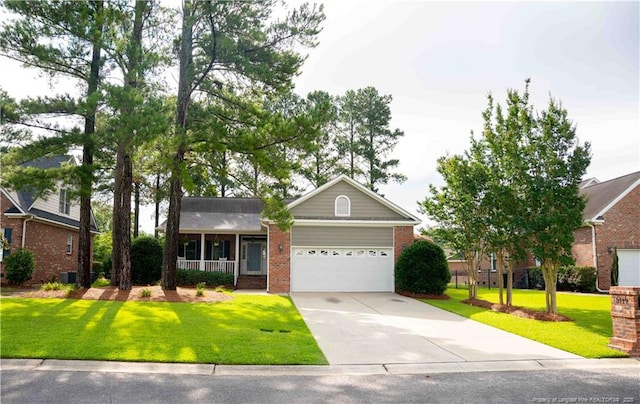 3119 Metthame Dr, Fayetteville, NC 28306 - view of front of property with brick siding, an attached garage, a front yard, and concrete driveway