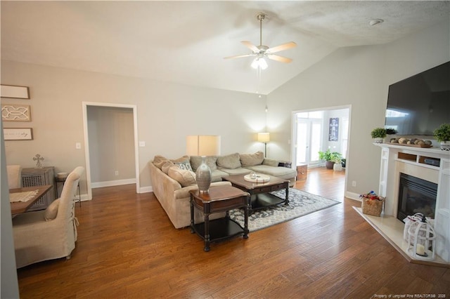 3119 Metthame Dr, Fayetteville, NC 28306 - living area with ceiling fan, wood finished floors, a glass covered fireplace, and high vaulted ceiling