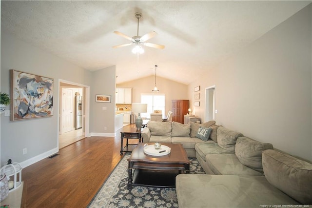 3119 Metthame Dr, Fayetteville, NC 28306 - living area with vaulted ceiling, wood finished floors, and a ceiling fan