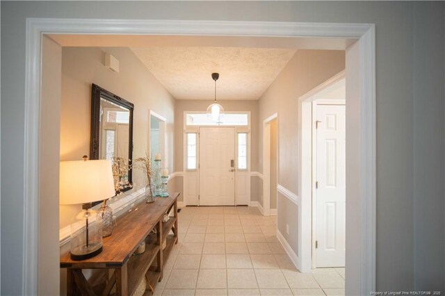 3119 Metthame Dr, Fayetteville, NC 28306 - entryway with light tile patterned flooring and a textured ceiling