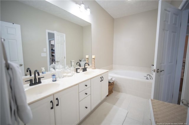 3119 Metthame Dr, Fayetteville, NC 28306 - full bathroom featuring a garden tub, double vanity, and tile patterned flooring