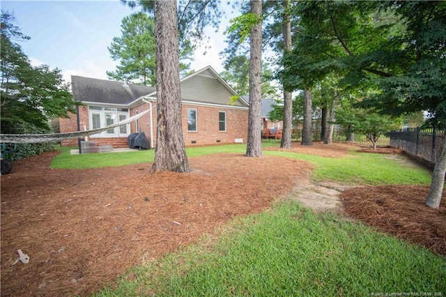 3119 Metthame Dr, Fayetteville, NC 28306 - rear view of property with brick siding and crawl space