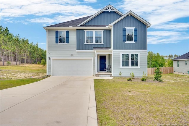 view of front of property featuring an attached garage, board and batten siding, and driveway