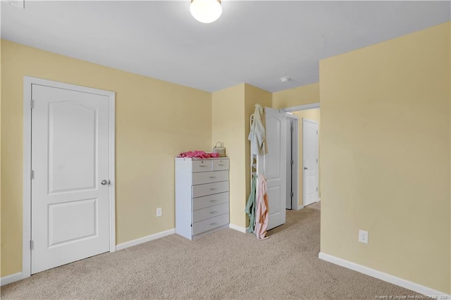 carpeted bedroom with baseboards