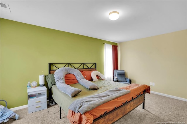 bedroom featuring carpet and baseboards