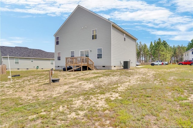 back of property with crawl space, a wooden deck, central air condition unit, and stairway
