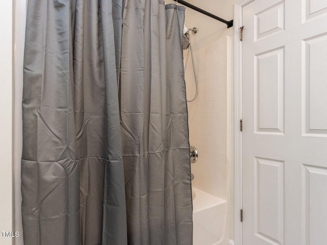 full bathroom with shower / bathtub combination with curtain