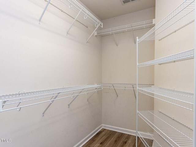 spacious closet with wood finished floors