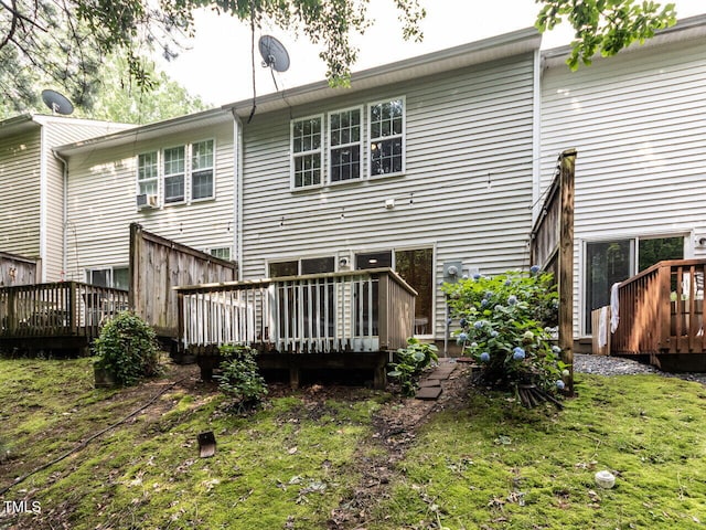 back of house featuring a deck