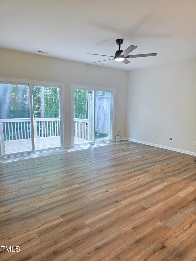 4206 Camden Woods Ct, Raleigh, NC 27612 - empty room with a ceiling fan, wood finished floors, and baseboards