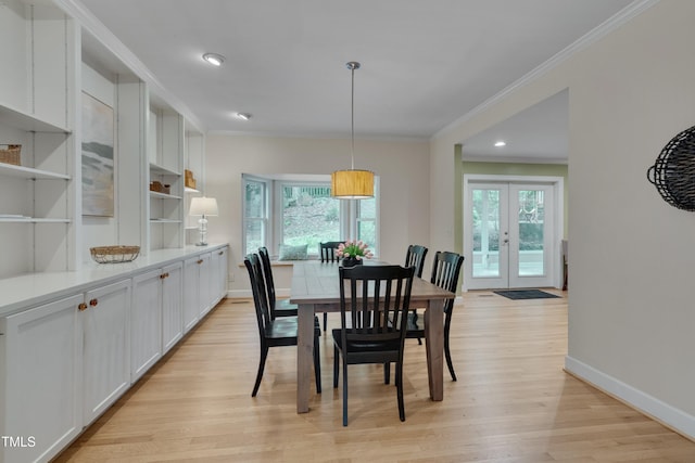 dining space featuring crown molding, light wood-type flooring, french doors, baseboards, and recessed lighting