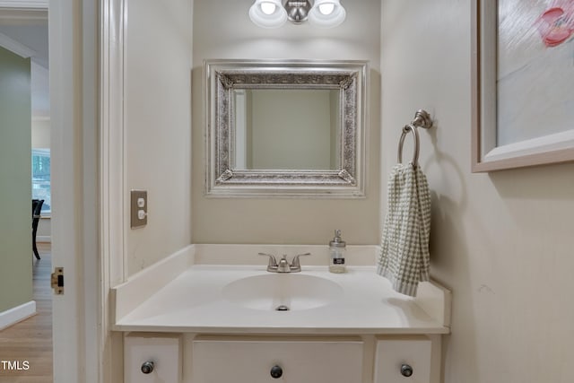 bathroom featuring vanity and wood finished floors