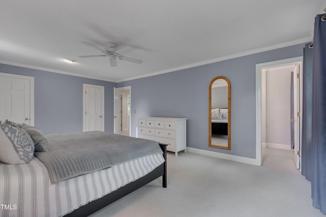 bedroom with light colored carpet, baseboards, ornamental molding, and ceiling fan
