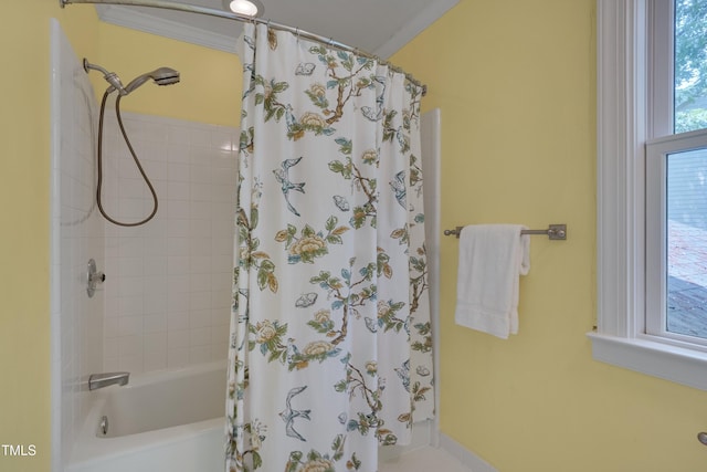 bathroom featuring shower / bath combo and crown molding