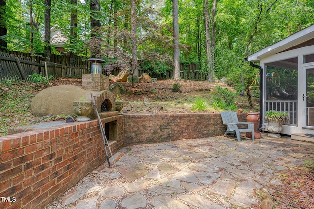 view of patio / terrace with a sunroom