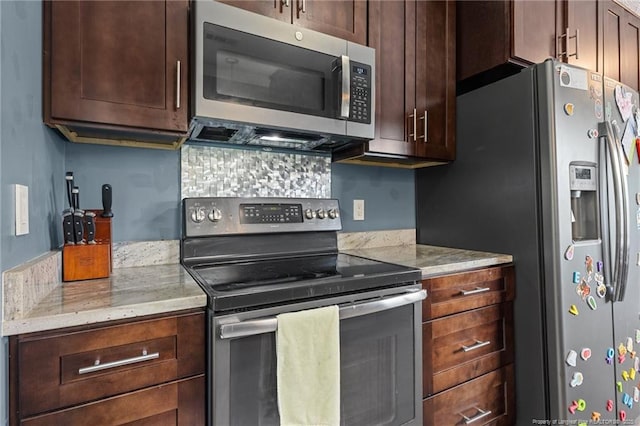 5712 Icarus Cir, Fayetteville, NC 28304 - kitchen with appliances with stainless steel finishes, light stone countertops, and dark brown cabinetry