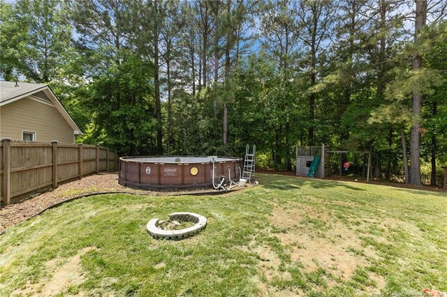 5712 Icarus Cir, Fayetteville, NC 28304 - view of yard featuring an outdoor pool