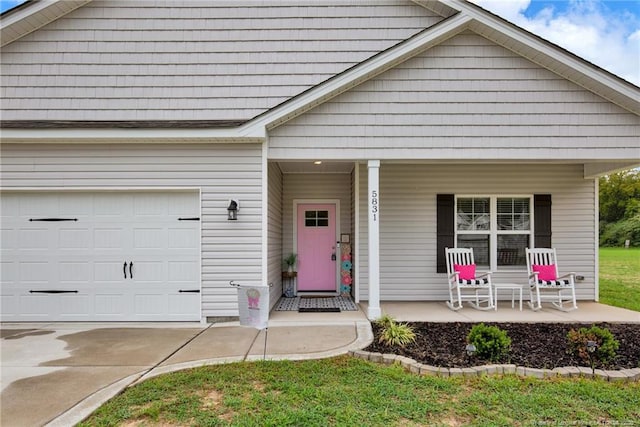 5831 James Allen Ln, Stedman, NC 28391 - view of front of house featuring a porch, a garage, and concrete driveway