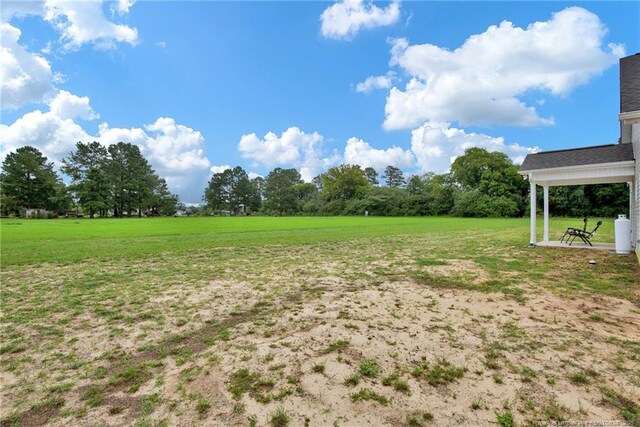 5831 James Allen Ln, Stedman, NC 28391 - view of grassy yard featuring a rural view